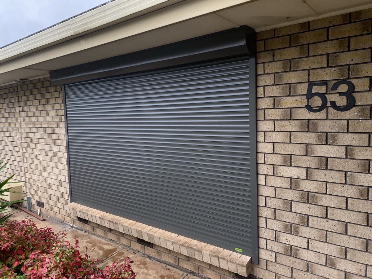 Charcoal roller shutter brick home